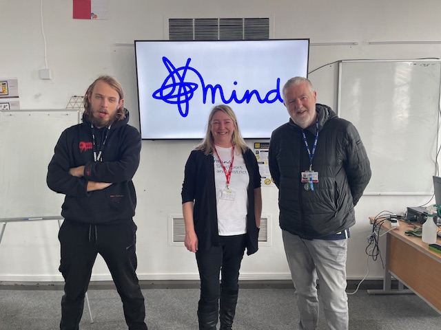 Mind staff and a student posing for picture