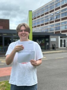 John Fore happily holding his results
